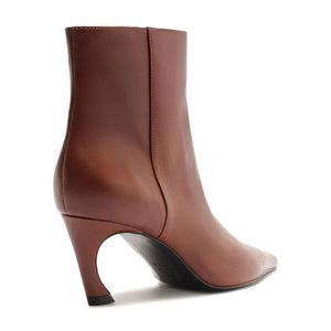 Side view of Lexi leather bootie in warm toffee showcasing pointed toe and sculpted heel with white background