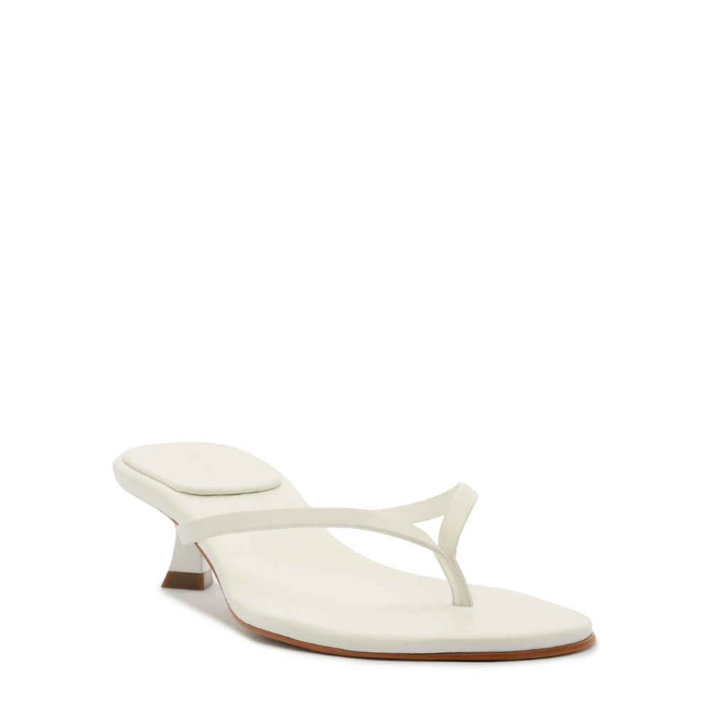 Angled front view of Carolyn Sandal showcasing thong strap, low heel, and padded footbed on white background
