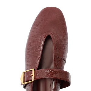Courtney Buckle Patent Flat in Vino