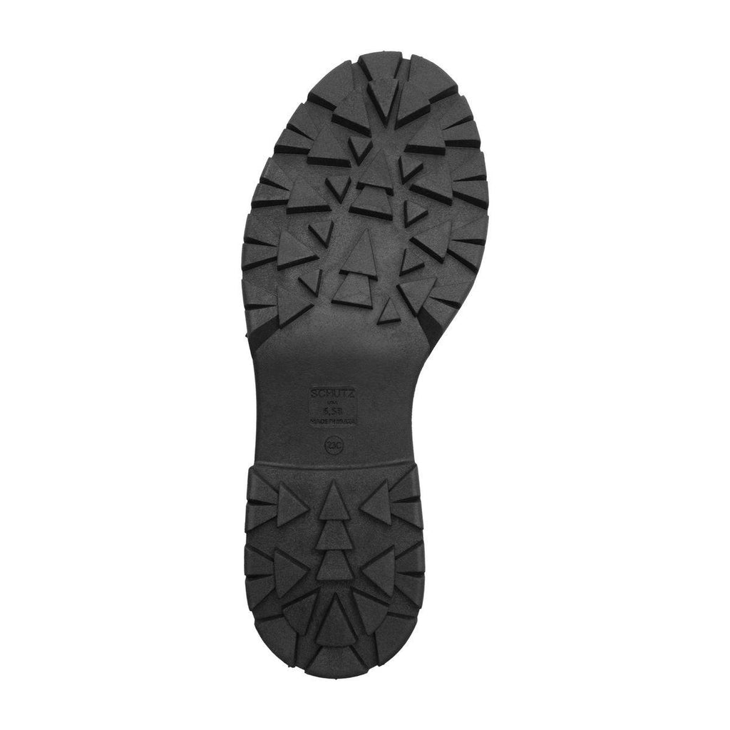 Bottom view of Rita Bootie in Black showcasing its substantial lug sole with a white background