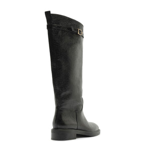 Side view of Bianca leather boot in black showcasing its knee-high shaft and low block heel against a white background