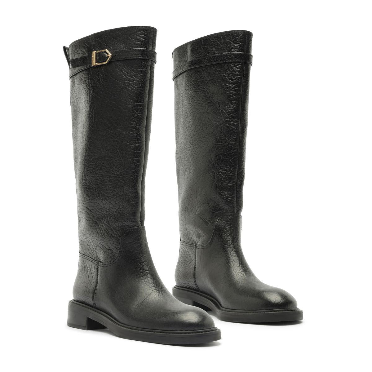 Three-quarter view of the Bianca leather boots in black showcasing knee-high shafts, rounded toes, and low block heels