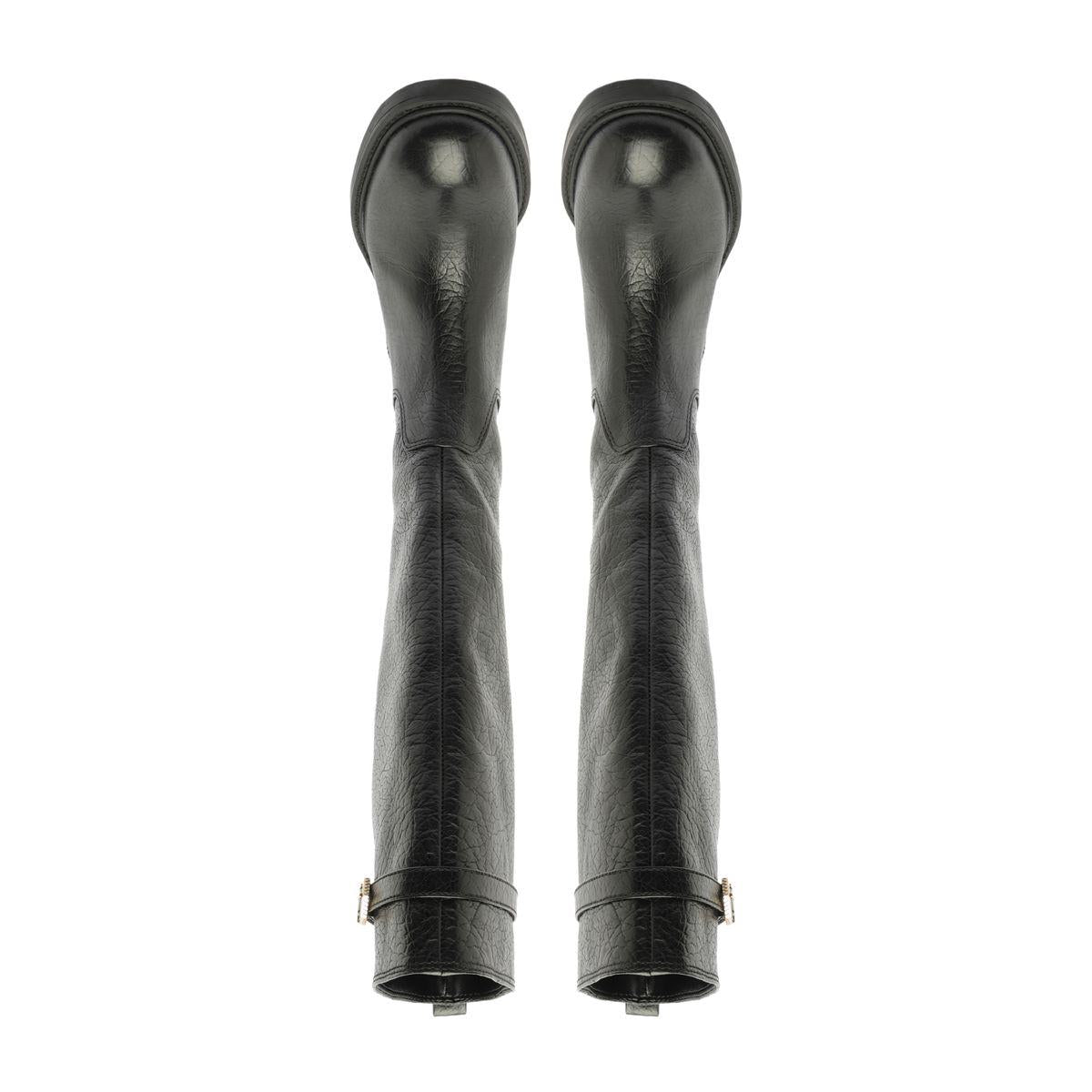 Rear view of the Bianca Leather Boot in Black showcasing its knee-high slip-on design with a white background