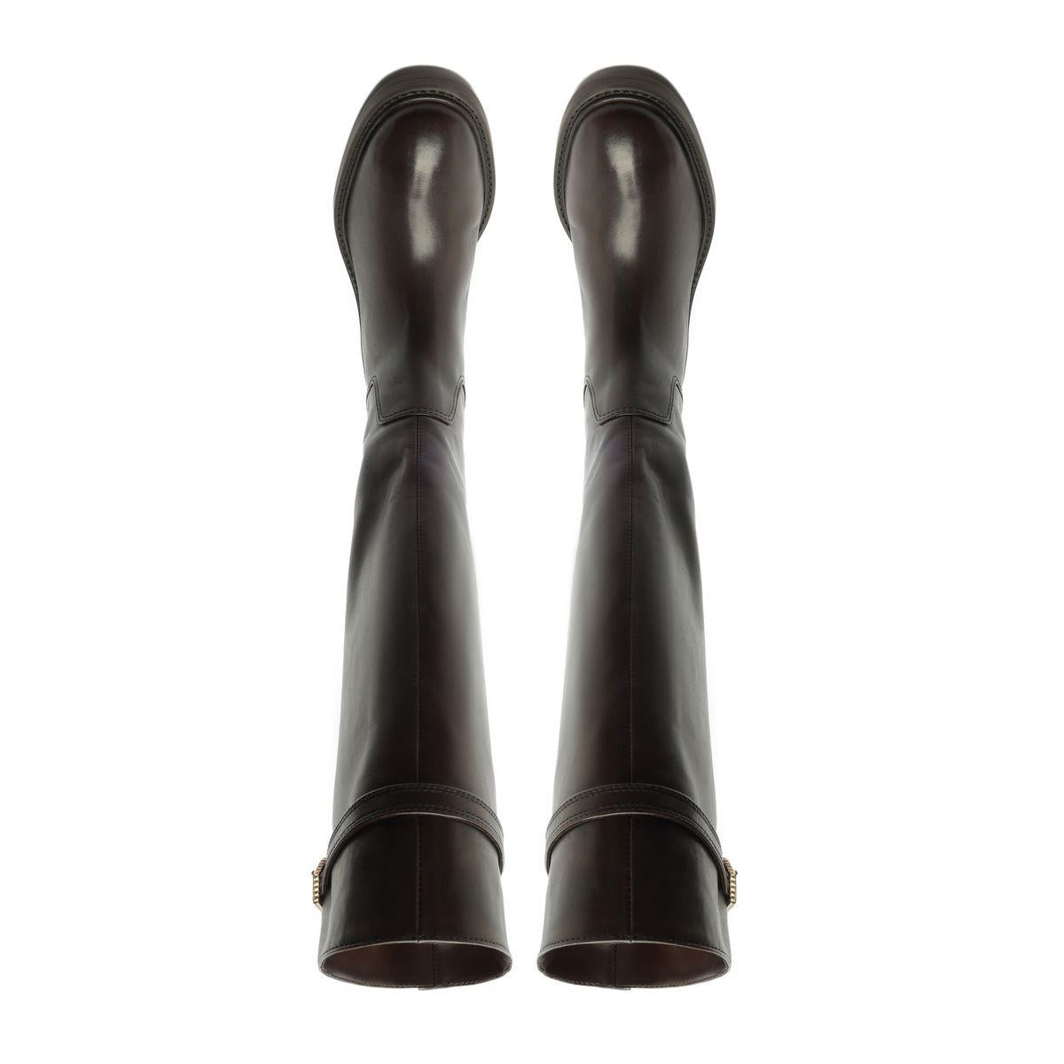 Rear view of Bianca leather boots in Maplewood showcasing tall shafts and heels against a white background