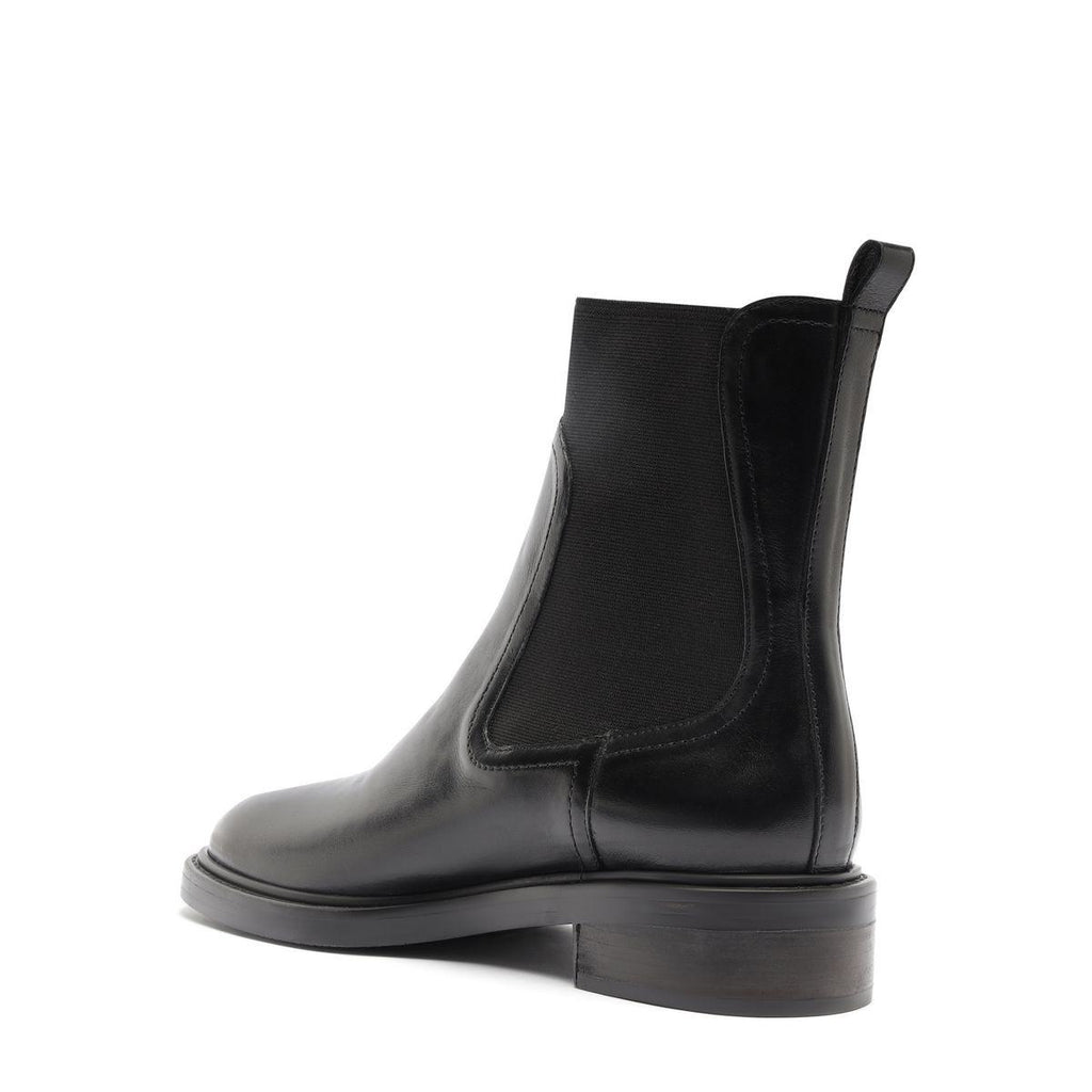 Side view of Olivia Bootie in Black showcasing its elastic side panel and block heel against a white background