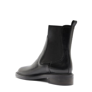 Side view of Olivia Bootie in Black showcasing its elastic side panel and block heel against a white background