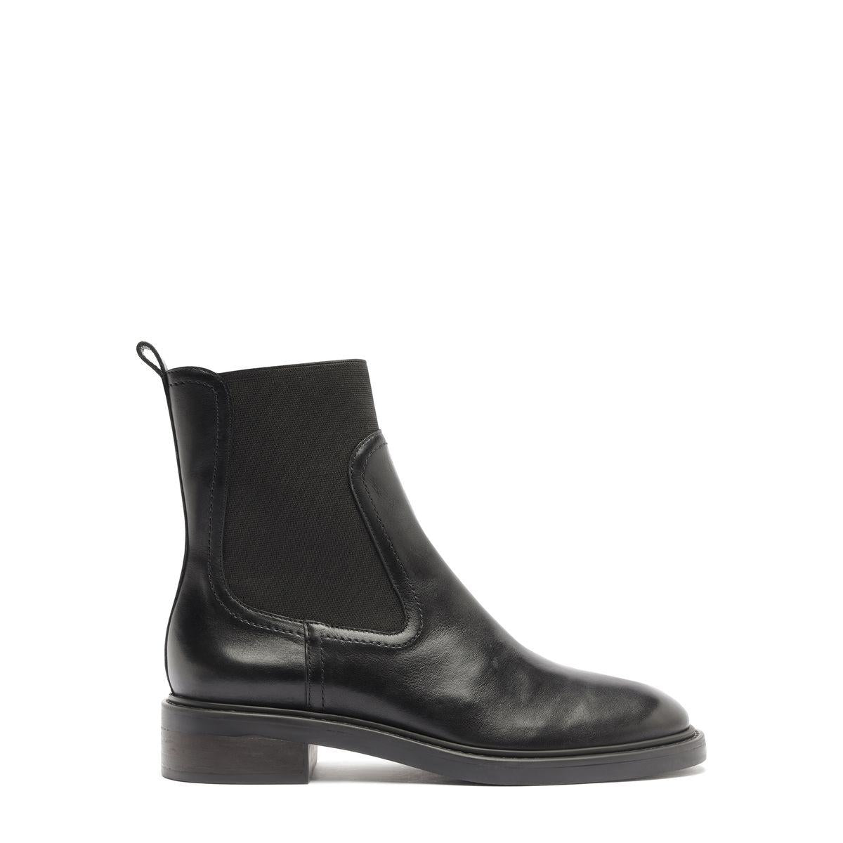 Side view of Olivia Bootie in Black showcasing an elastic side panel and low block heel against a white background