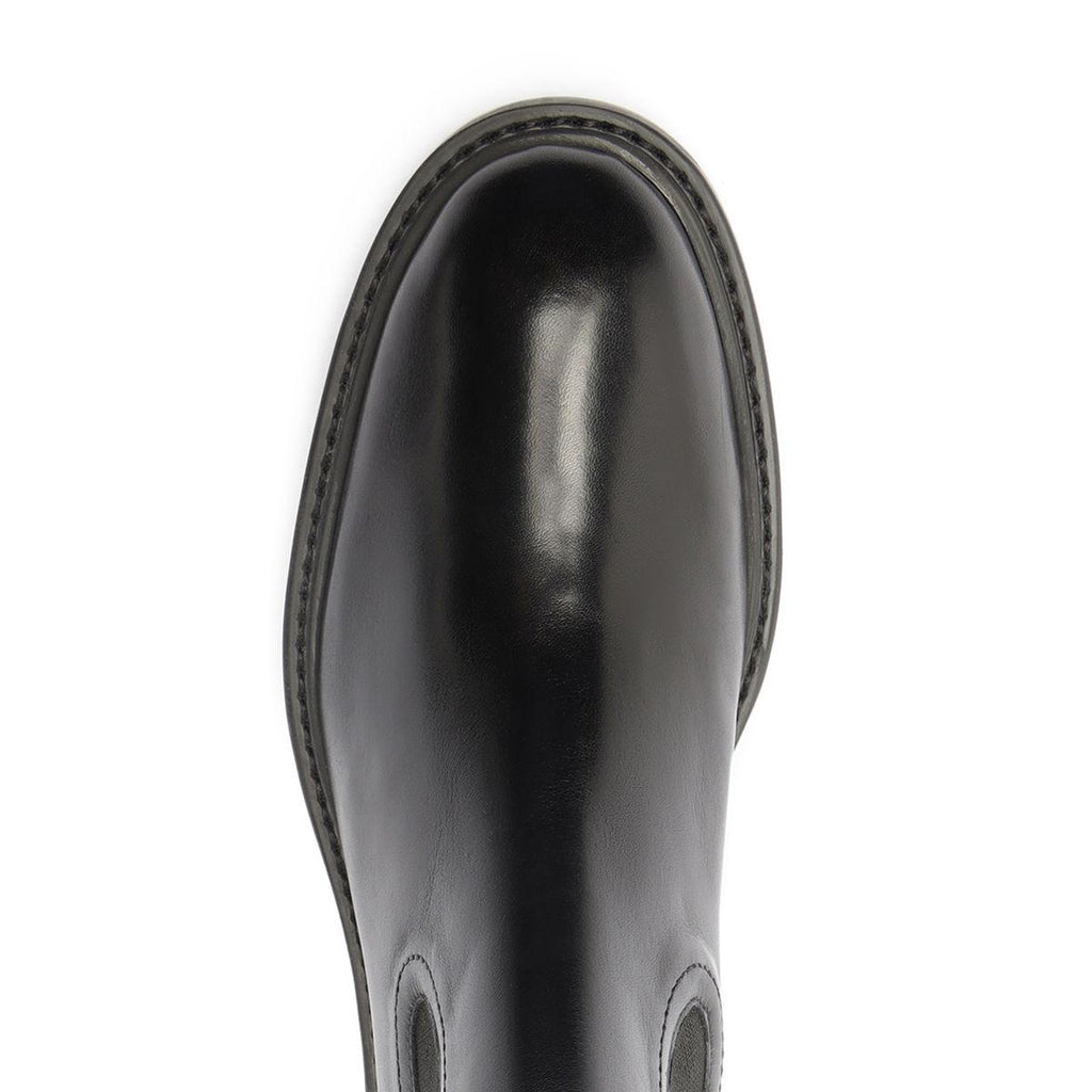 Top view of black Olivia bootie showcasing its glossy finish on a white background