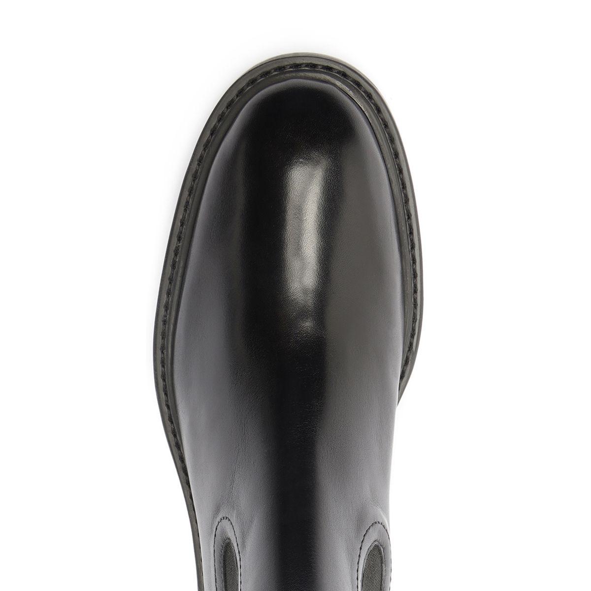 Top view of black Olivia bootie showcasing its glossy finish on a white background