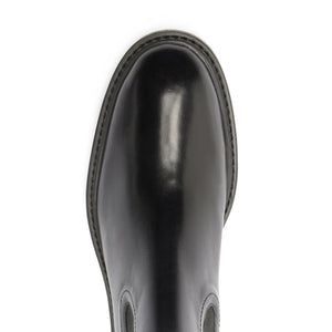 Top view of black Olivia bootie showcasing its glossy finish on a white background