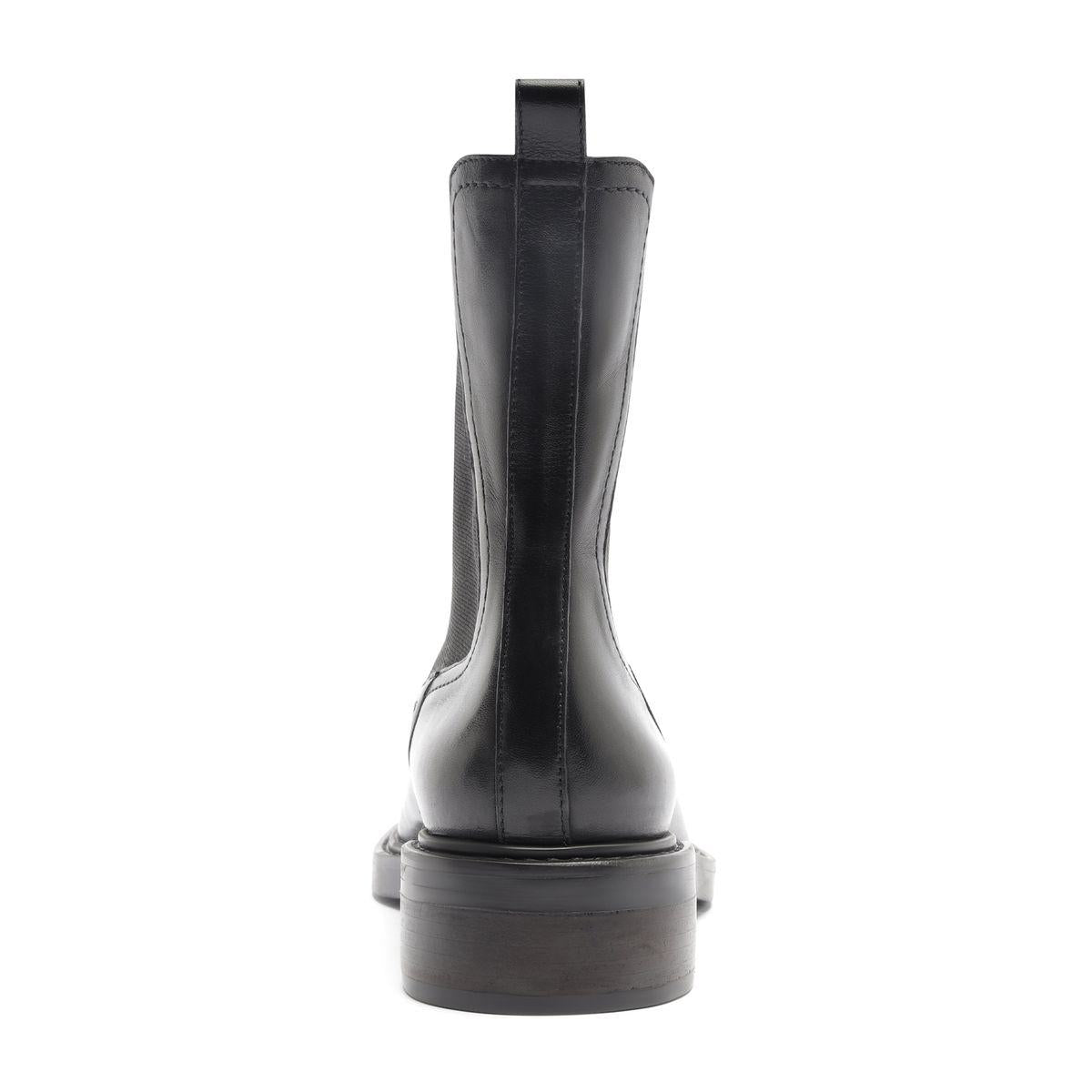 Rear view of Olivia Bootie in Black showcasing the pull tab and block heel with a white background