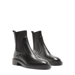Front three-quarter view of Olivia Bootie in Black showcasing low block heels on a white background