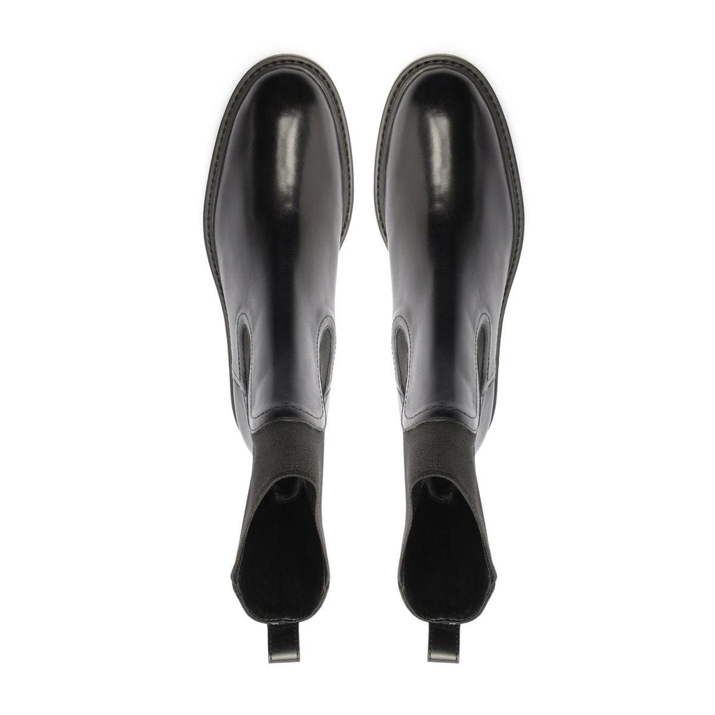 Rear view of Olivia Bootie in Black showcasing pull tabs with a white background