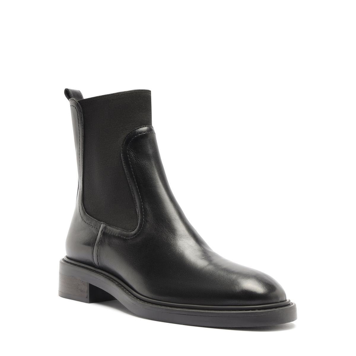 Three-quarter view of Olivia Bootie in Black showcasing its ankle-height shaft and low block heel against a white background