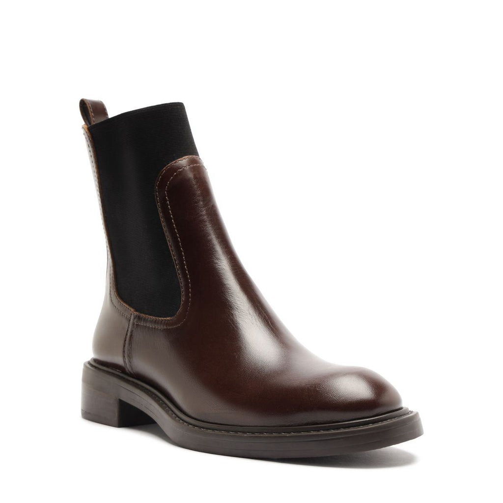 Front three-quarter view of Olivia Bootie in Root Brown showcasing side elastic panels and a block heel against a white background