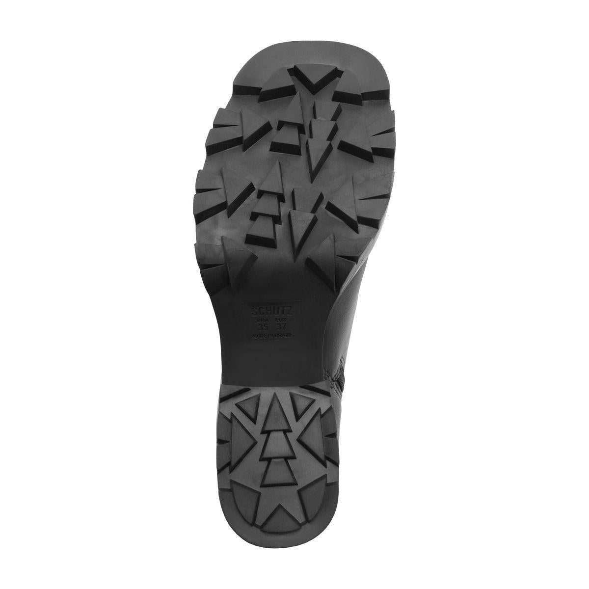 Bottom view of 240 Leather Bootie in Black showcasing a textured lugged sole on a white background