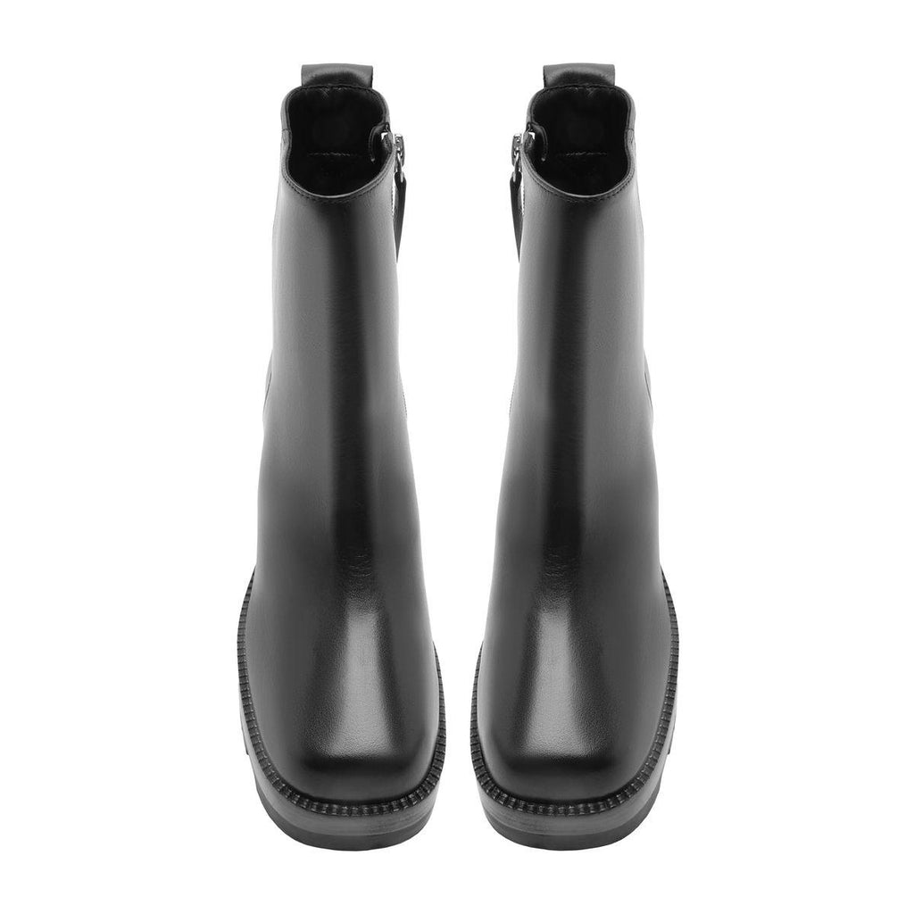 Rear view of 240 Leather Bootie in Black showcasing tall shafts and lugged soles against a white background
