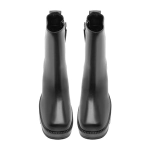 Rear view of 240 Leather Bootie in Black showcasing tall shafts and lugged soles against a white background