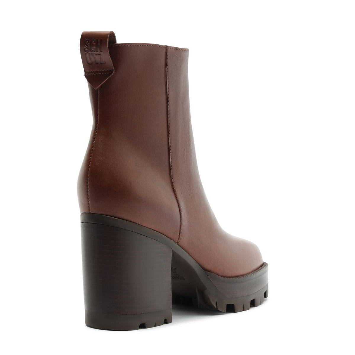 Side view of 240 leather bootie in warm toffee showcasing a tall block heel and platform sole on a white background