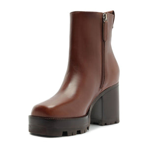 Side view of 240 Leather Bootie in Warm Toffee showcasing side zipper, block heel, and lug sole on white background