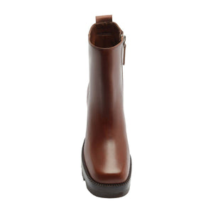 Front view of 240 leather bootie in warm toffee showcasing its tall shaft and lugged sole with a white background