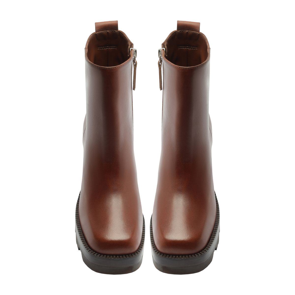 Front view of 240 leather booties in warm toffee showcasing rounded toes and ankle-height shafts on a white background