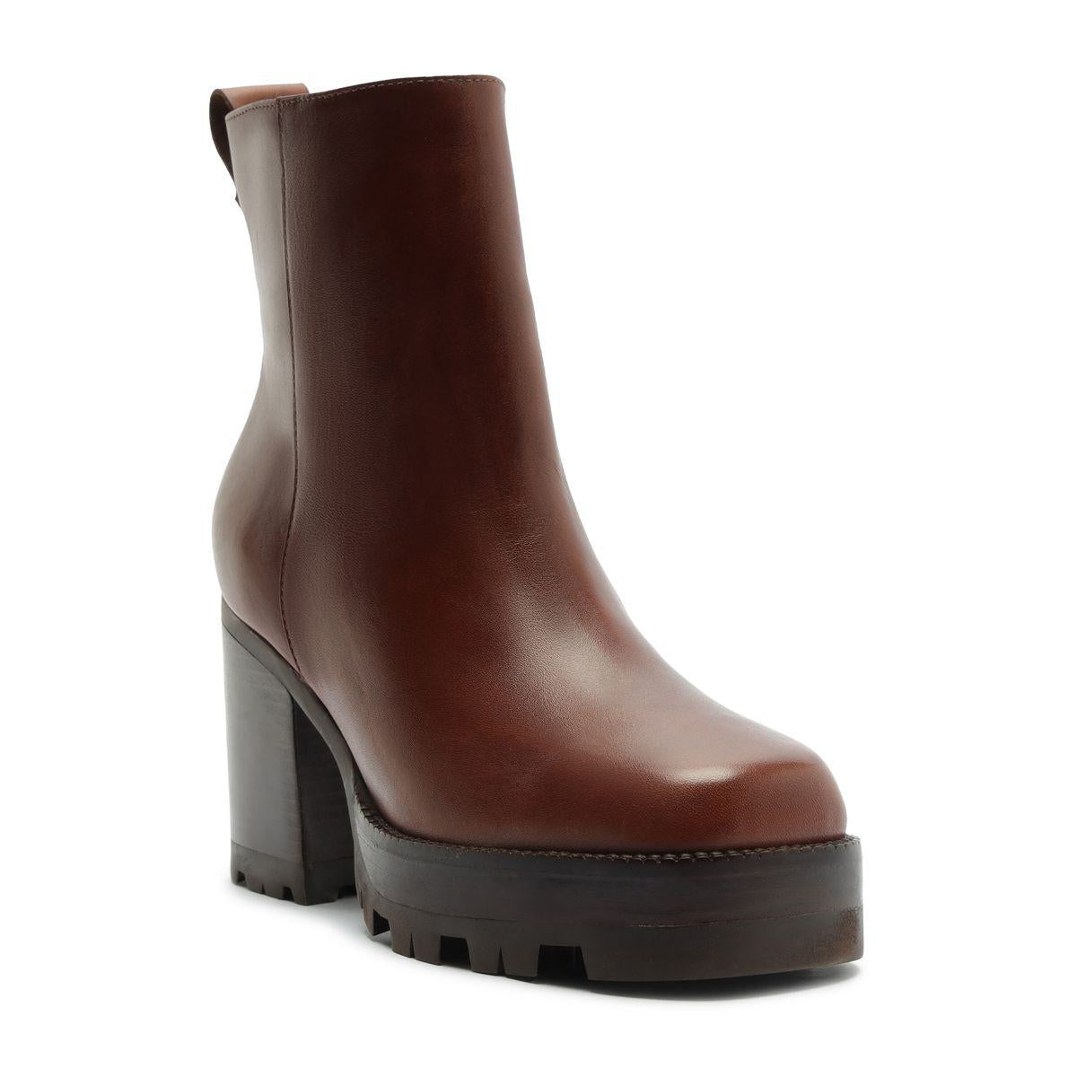 Three-quarter view of 240 Leather Bootie in Warm Toffee showcasing its brown leather upper and chunky platform heel on a white background