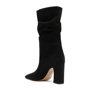 Side view of Harriet suede boot in black showcasing its tall slouchy shaft and high heel against a white background