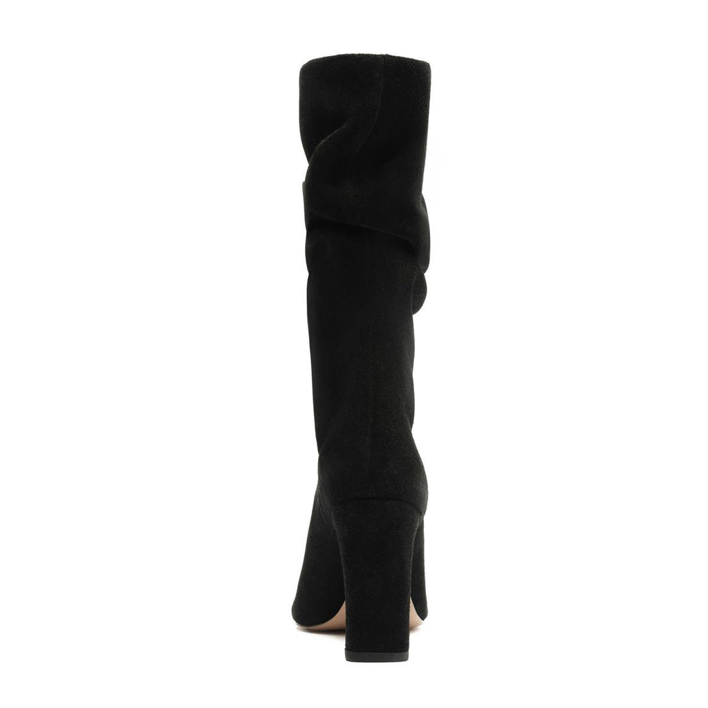 Rear view of Harriet suede boot in black showcasing its tall shaft and heel with a white background