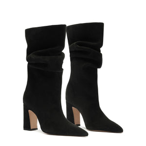 Front view of Harriet suede boots in black showcasing slouchy shafts and block heels on a white background