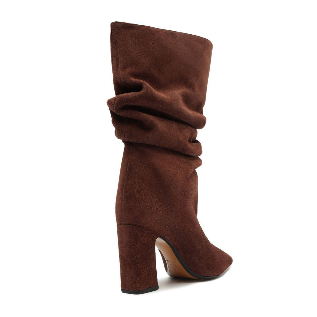Side view of Harriet suede boot in pecan brown showcasing its slouchy shaft and block heel with a white background