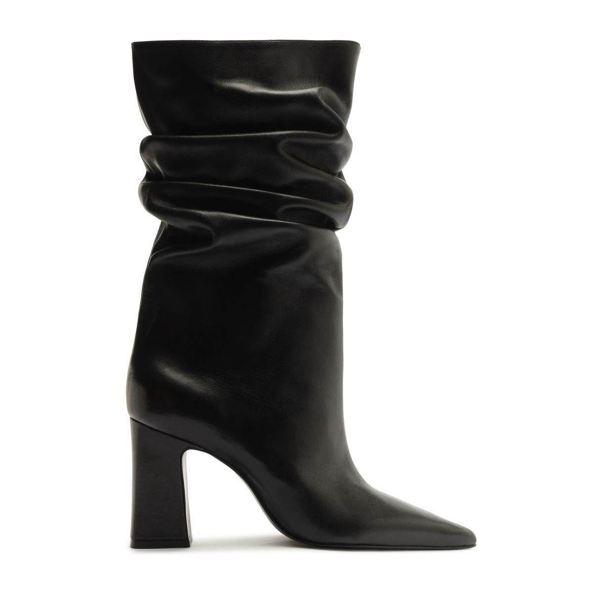 Side view of Harriet leather boot in black showcasing its ruched shaft, pointed toe, and high block heel with a white background