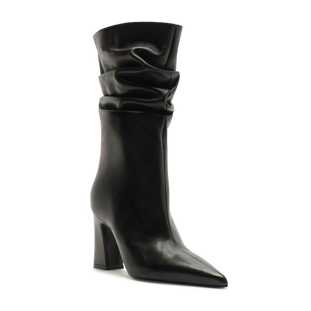 Three-quarter view of the Harriet Leather Boot in black showcasing its ruched shaft, pointed toe, and block heel on a white background