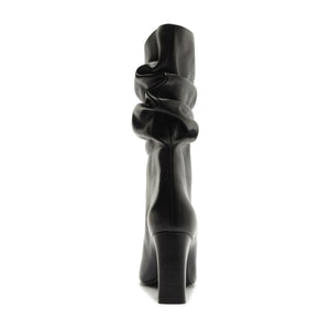 Rear view of Harriet leather boot in black showcasing its ruched shaft and block heel with a white background
