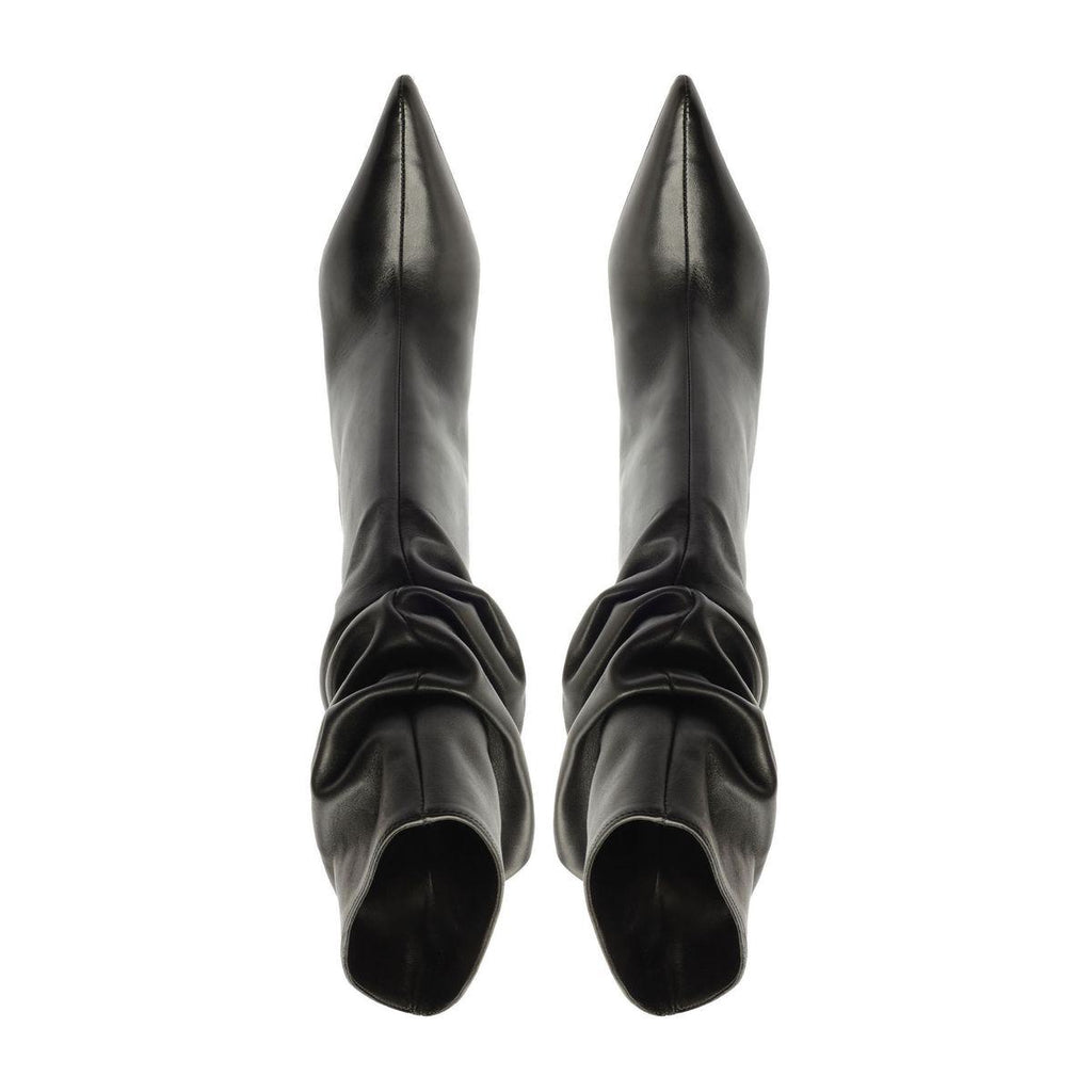 Overhead view of Harriet Leather Boot in black showcasing pointed toes and ruched shafts with a white background