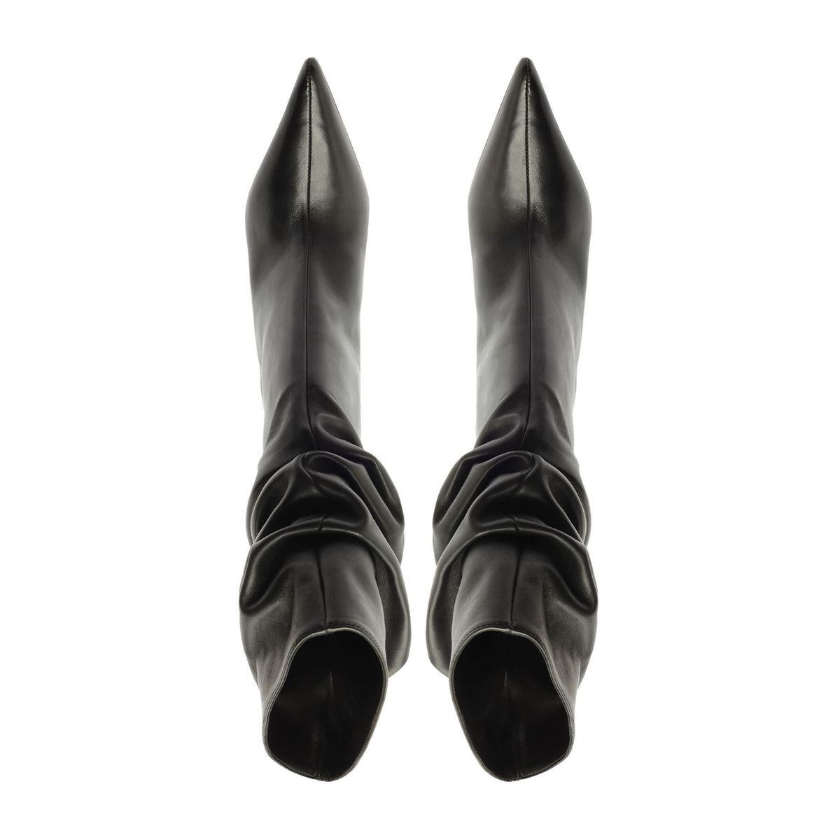 Overhead view of Harriet Leather Boot in black showcasing pointed toes and ruched shafts with a white background