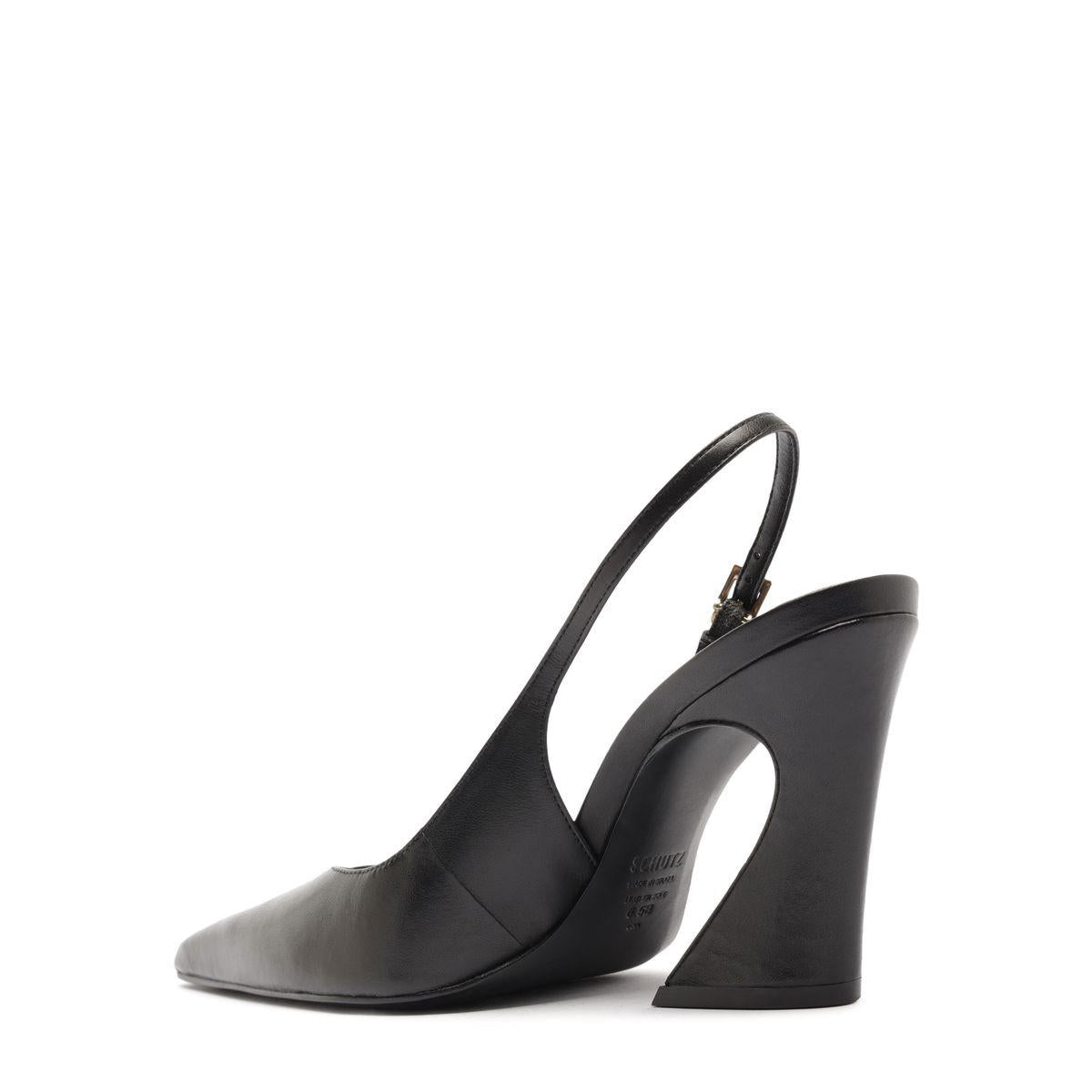 Side view of Lexi Sling Block Leather Pump in Black showcasing its pointed toe, slingback strap, and sculptural block heel