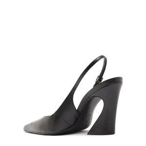 Side view of Lexi Sling Block Leather Pump in Black showcasing its pointed toe, slingback strap, and sculptural block heel