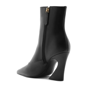 Side view of Lexi Mid Leather Bootie in Black showcasing pointed toe, block heel, and zip closure with a white background