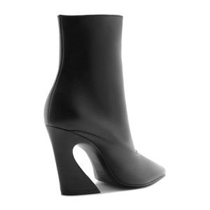 Side view of Lexi Mid Leather Bootie in black showcasing the pointed toe and block heel against a white background