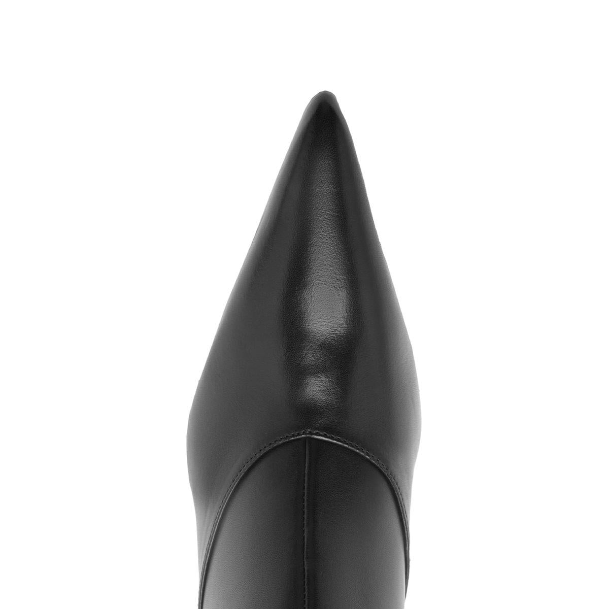 Close-up front view of Lexi Mid Leather Bootie in black showcasing its pointed toe with a white background