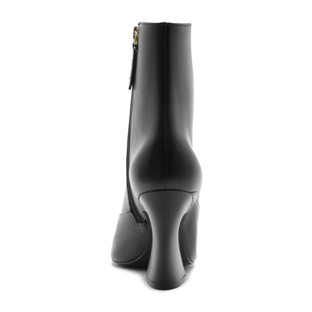 Rear view of the Lexi Mid Leather Bootie in Black showcasing its leather shaft and block heel against a white background
