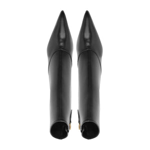 Rear view of Schutz Lexi Mid Leather Bootie in Black showcasing pointed toes and tall shafts against a white background