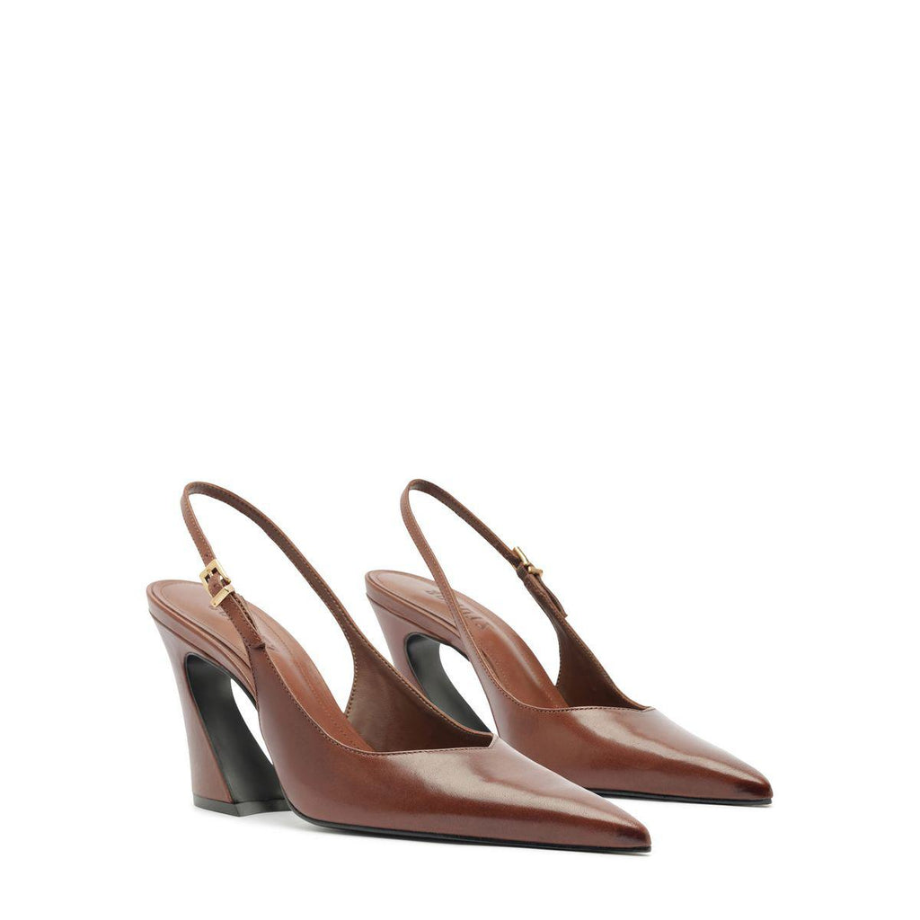 Three-quarter view of Lexi sling block leather pumps in warm toffee showcasing pointed toes and slingback straps on white