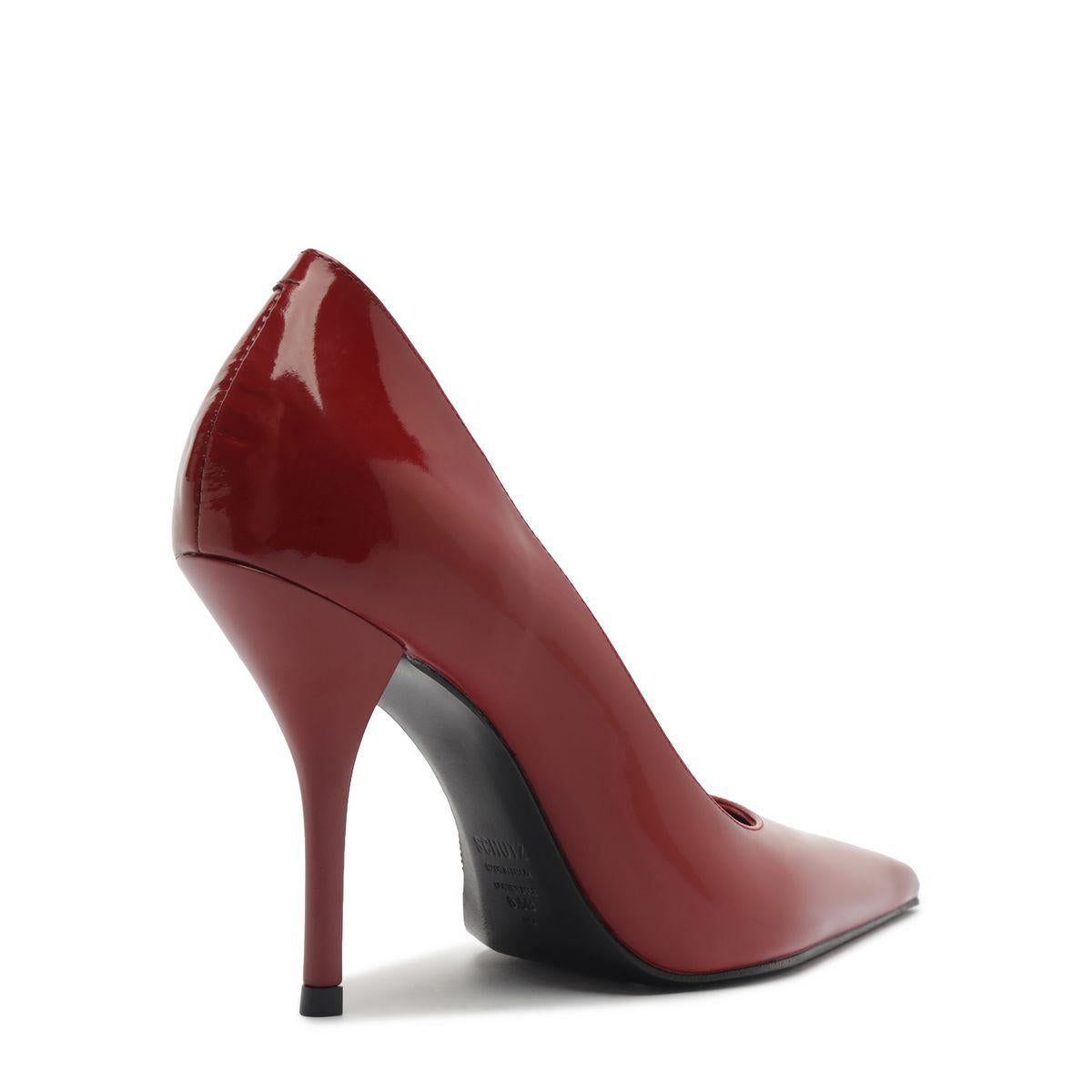 Side view of Miranda Patent Pump in Passion Red showcasing pointed toe and high stiletto heel against a white background
