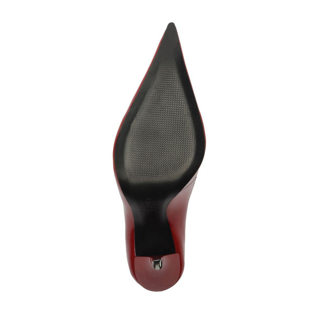 Underside view of Miranda patent pump in passion red showcasing a black textured sole on a white background