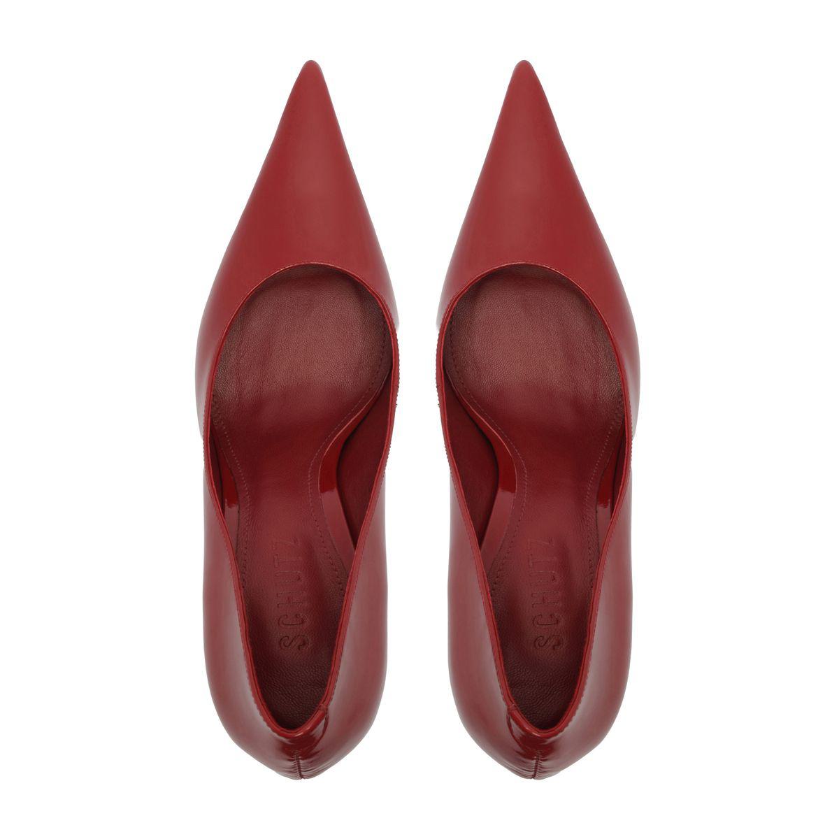 Top view of Miranda Patent Pump in Passion Red showcasing pointed toes and glossy patent finish on a white background