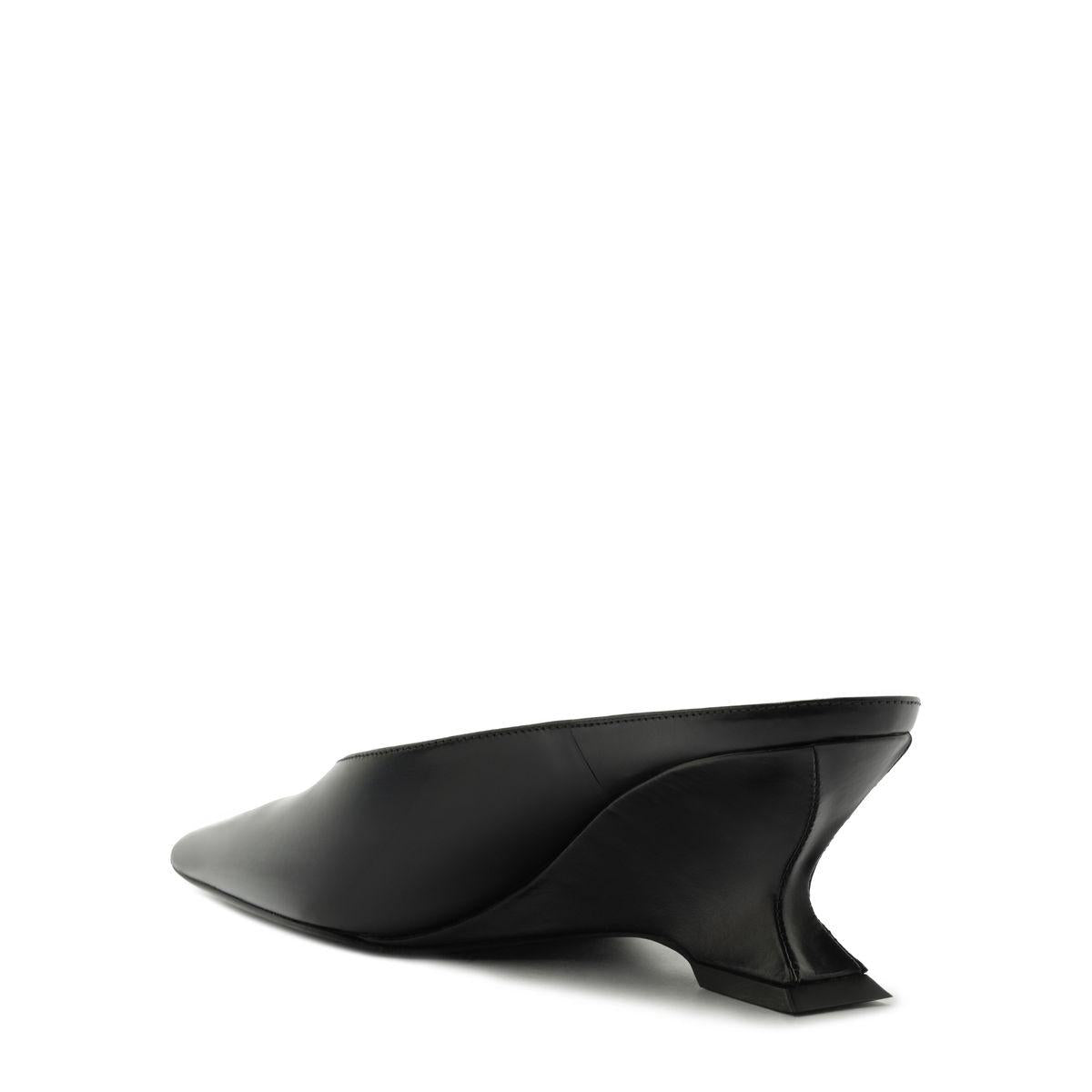 Side view of Siena Mid Mule Pump in black showcasing a pointed toe and sculptural heel on a white background