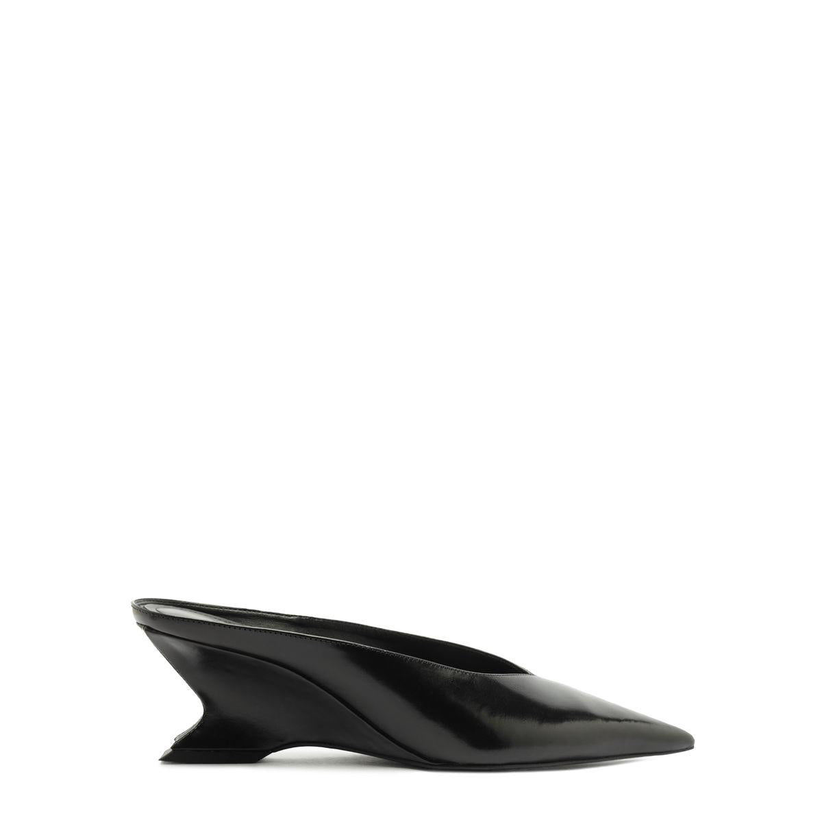 Side view of Siena Mid Mule Pump in Black showcasing sculptural wedge heel against a white background