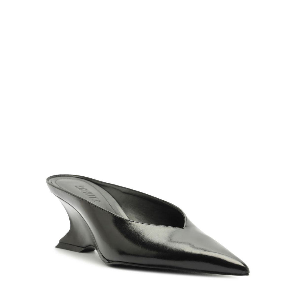 Side view of Siena mid mule pump in black showcasing its pointed toe and sculptural heel on a white background